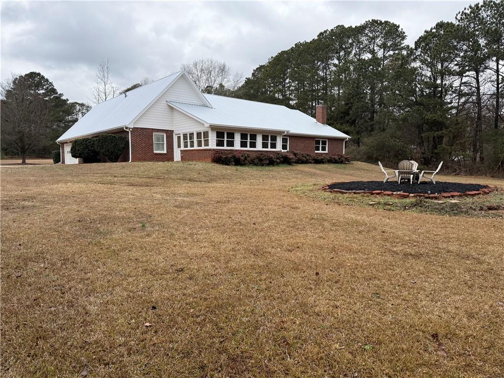 3280 Stanton Road Southeast Conyers, GA 30094 - Photo 12 of 49 a front view of a house with a yard
