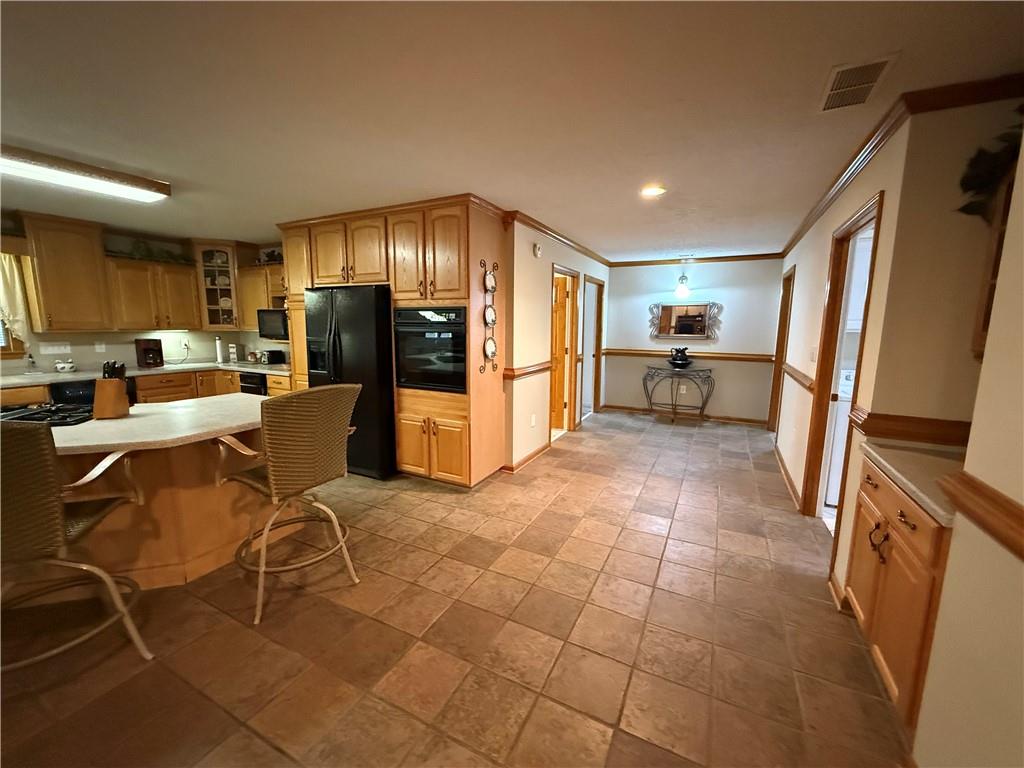 3280 Stanton Road Southeast Conyers, GA 30094 - Photo 18 of 49 a open kitchen with stainless steel appliances granite countertop a refrigerator and chairs