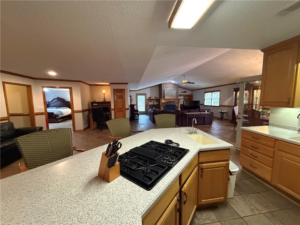 3280 Stanton Road Southeast Conyers, GA 30094 - Photo 20 of 49 a kitchen with stainless steel appliances granite countertop a stove top oven a sink dishwasher and cabinets with wooden floor