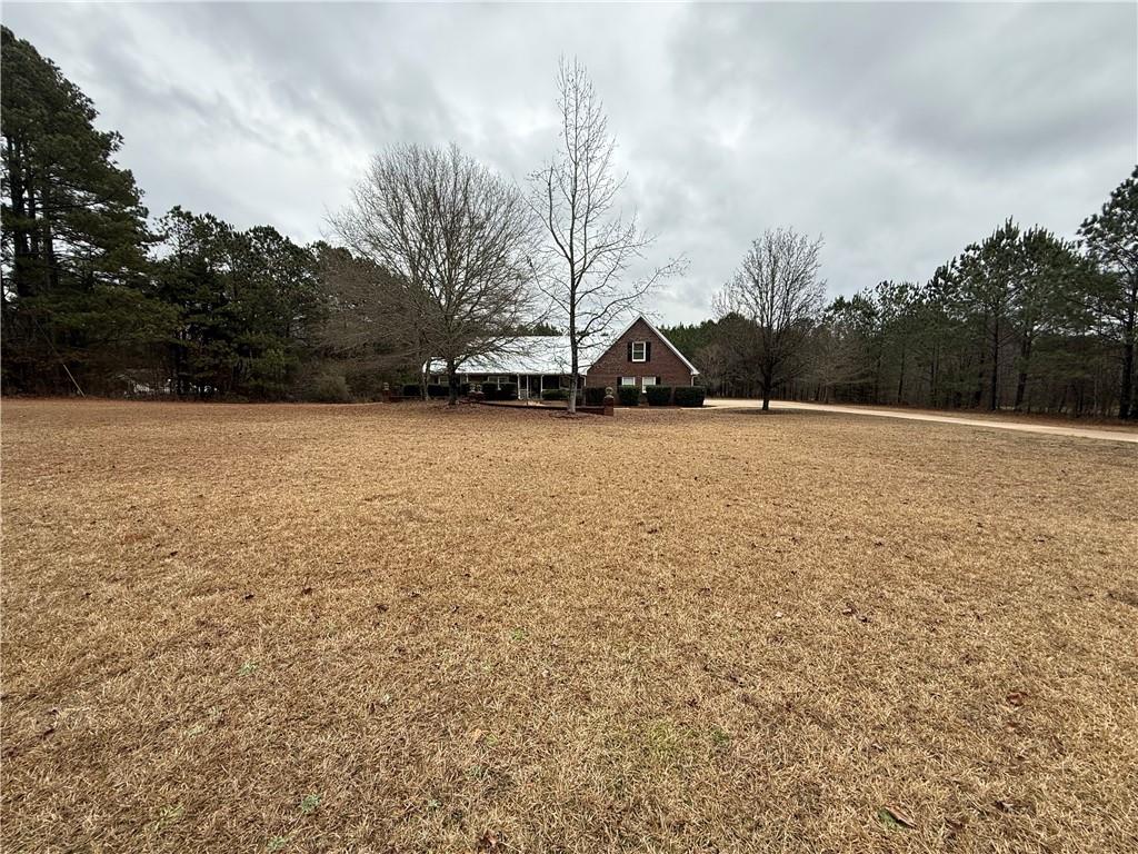 3280 Stanton Road Southeast Conyers, GA 30094 - Photo 2 of 49 a view of empty field with trees