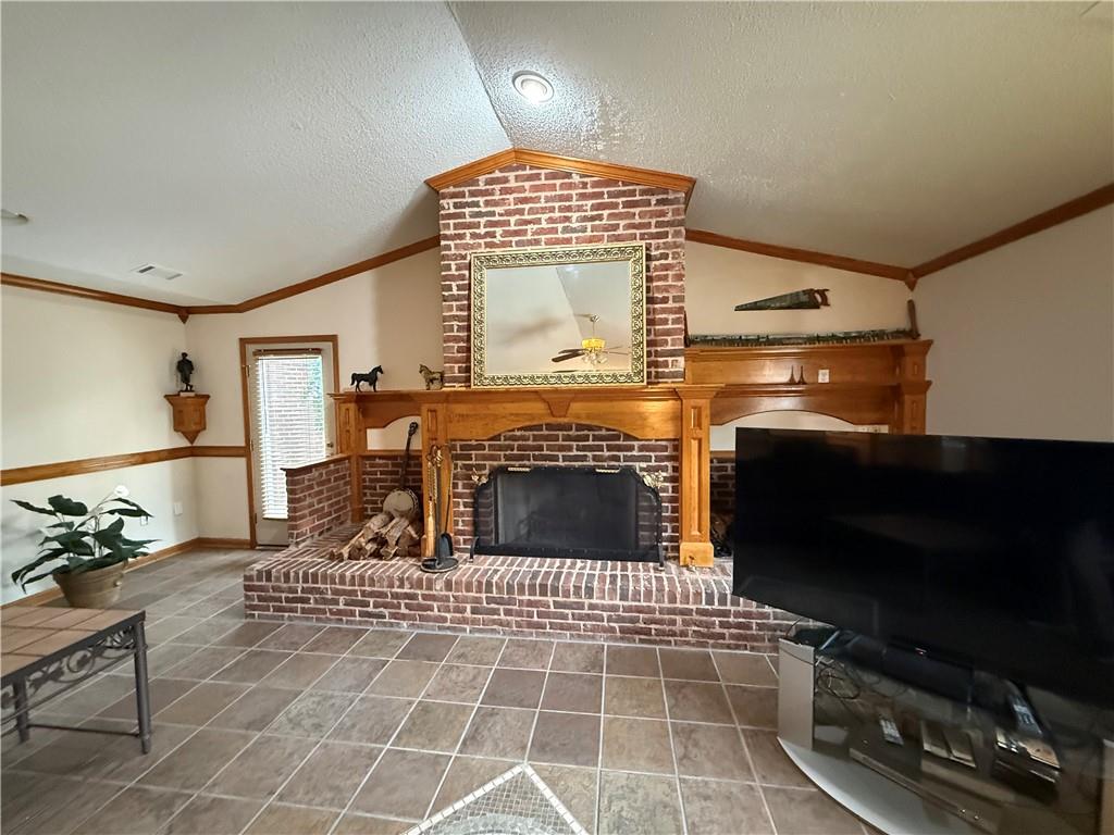 3280 Stanton Road Southeast Conyers, GA 30094 - Photo 23 of 49 a living room with furniture a flat screen tv and a fireplace