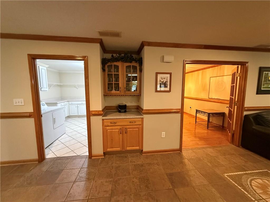 3280 Stanton Road Southeast Conyers, GA 30094 - Photo 27 of 49 a kitchen with stainless steel appliances granite countertop a refrigerator and a stove