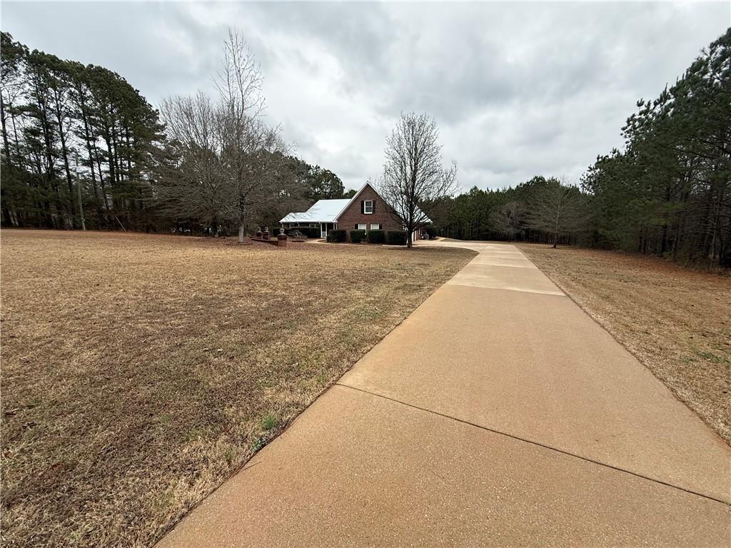 3280 Stanton Road Southeast Conyers, GA 30094 - Photo 3 of 49 a view of house with yard and trees in the background