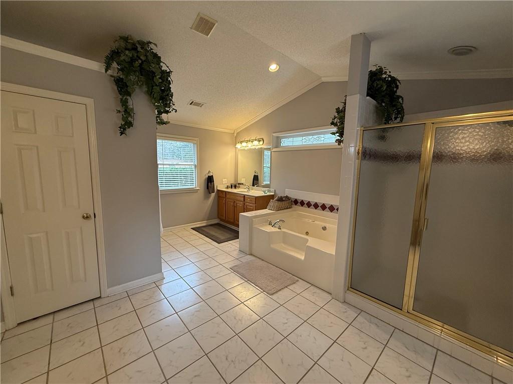 3280 Stanton Road Southeast Conyers, GA 30094 - Photo 33 of 49 a kitchen with stainless steel appliances a refrigerator and a stove top oven