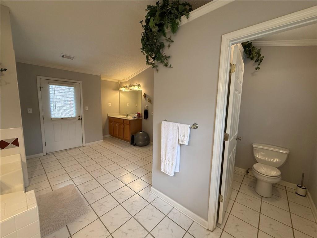 3280 Stanton Road Southeast Conyers, GA 30094 - Photo 34 of 49 a bathroom with a sink and a toilet