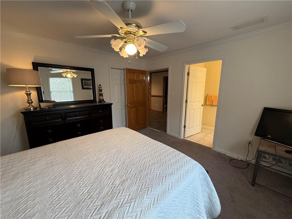 3280 Stanton Road Southeast Conyers, GA 30094 - Photo 36 of 49 a bedroom with a bed and a chandelier