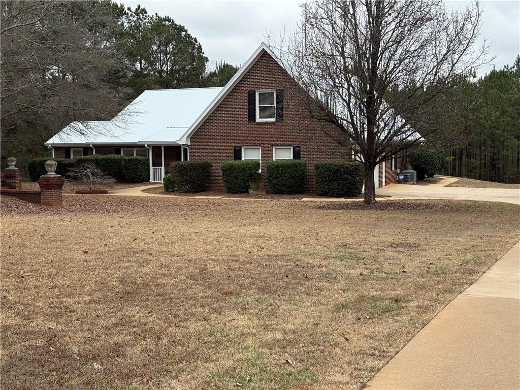 3280 Stanton Road Southeast Conyers, GA 30094 - Photo 4 of 49 a front view of a house with yard