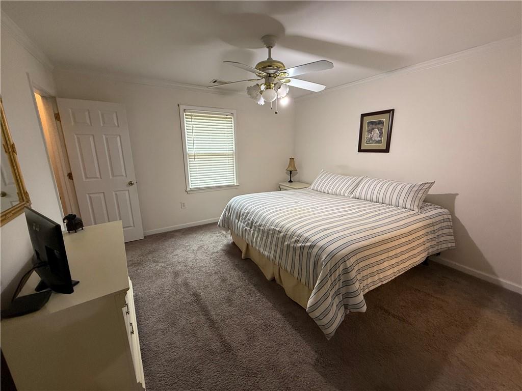 3280 Stanton Road Southeast Conyers, GA 30094 - Photo 41 of 49 a bedroom with a bed and a flat screen tv