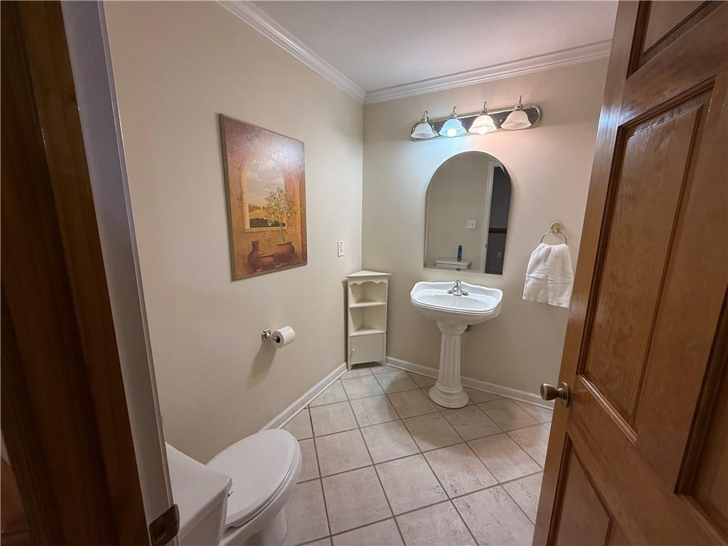 3280 Stanton Road Southeast Conyers, GA 30094 - Photo 43 of 49 a bathroom with a sink and mirror