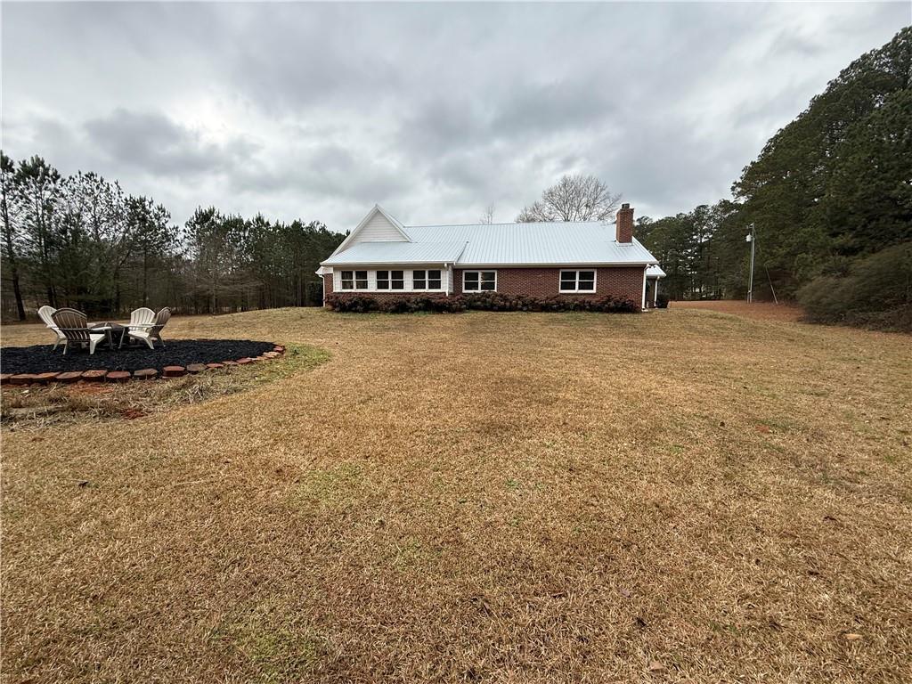 3280 Stanton Road Southeast Conyers, GA 30094 - Photo 10 of 49 a view of a house with a yard and sitting area
