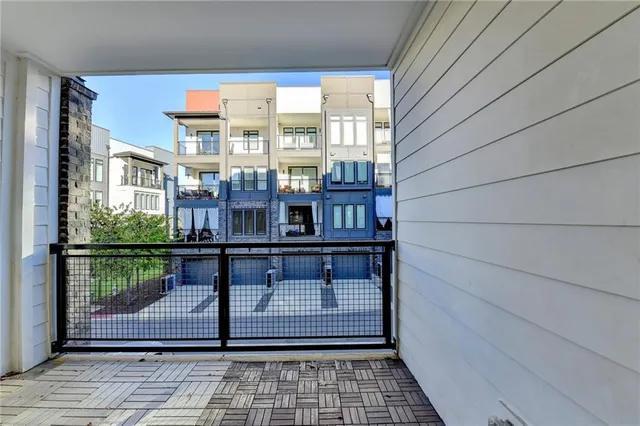 a large kitchen with kitchen island a table and chairs in it