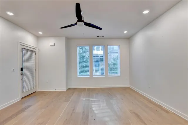 a view of an empty room with a window