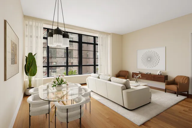 a living room with furniture and a floor to ceiling window