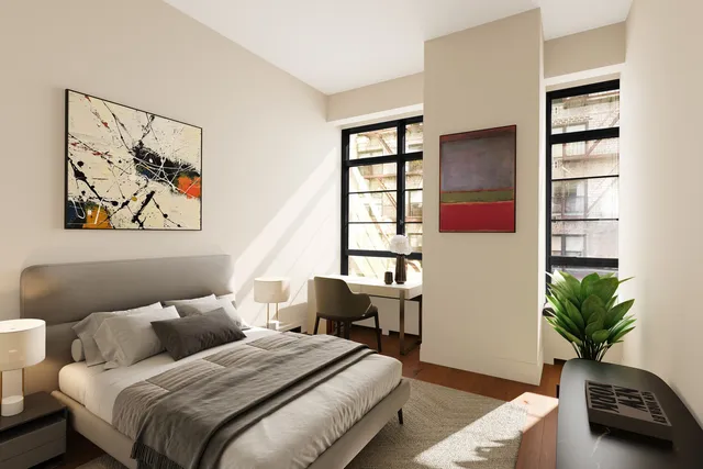 a bedroom with a bed and a potted plant