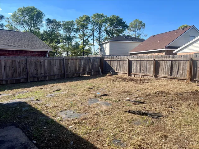 a view of a backyard of the house