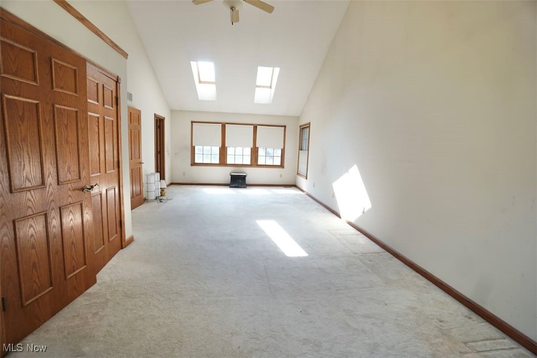 7060 Gates Road Gates Mills, OH 44040 - Photo 20 of 38 Master bedroom with carpet flooring, a skylight, high vaulted ceiling, and ceiling fan