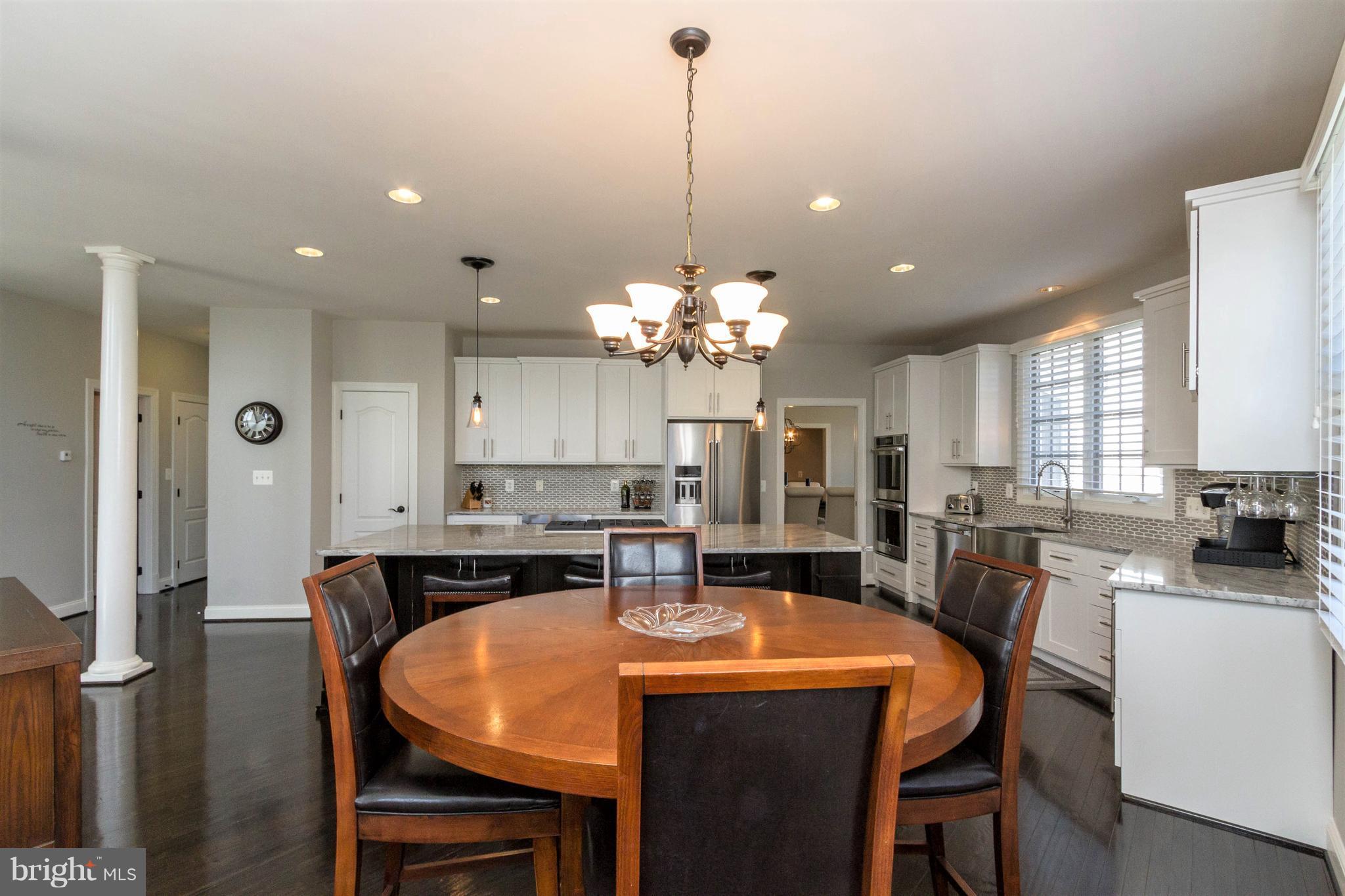 8247 Roxborough Loop Gainesville, VA 20155 - Photo 11 of 30 Rich Refinished Hardwood Floors on Main Level