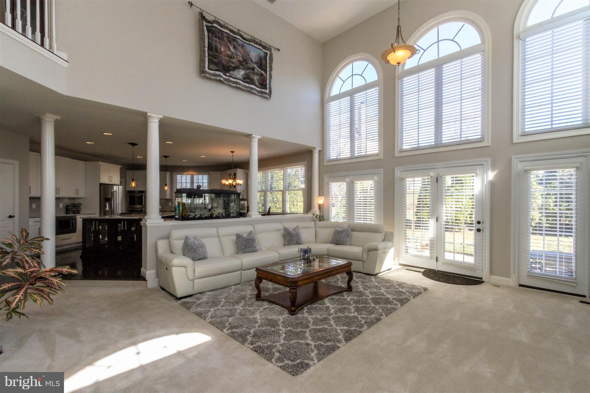 8247 Roxborough Loop Gainesville, VA 20155 - Photo 12 of 30 Family Room offers Soaring Two-Story Ceiling