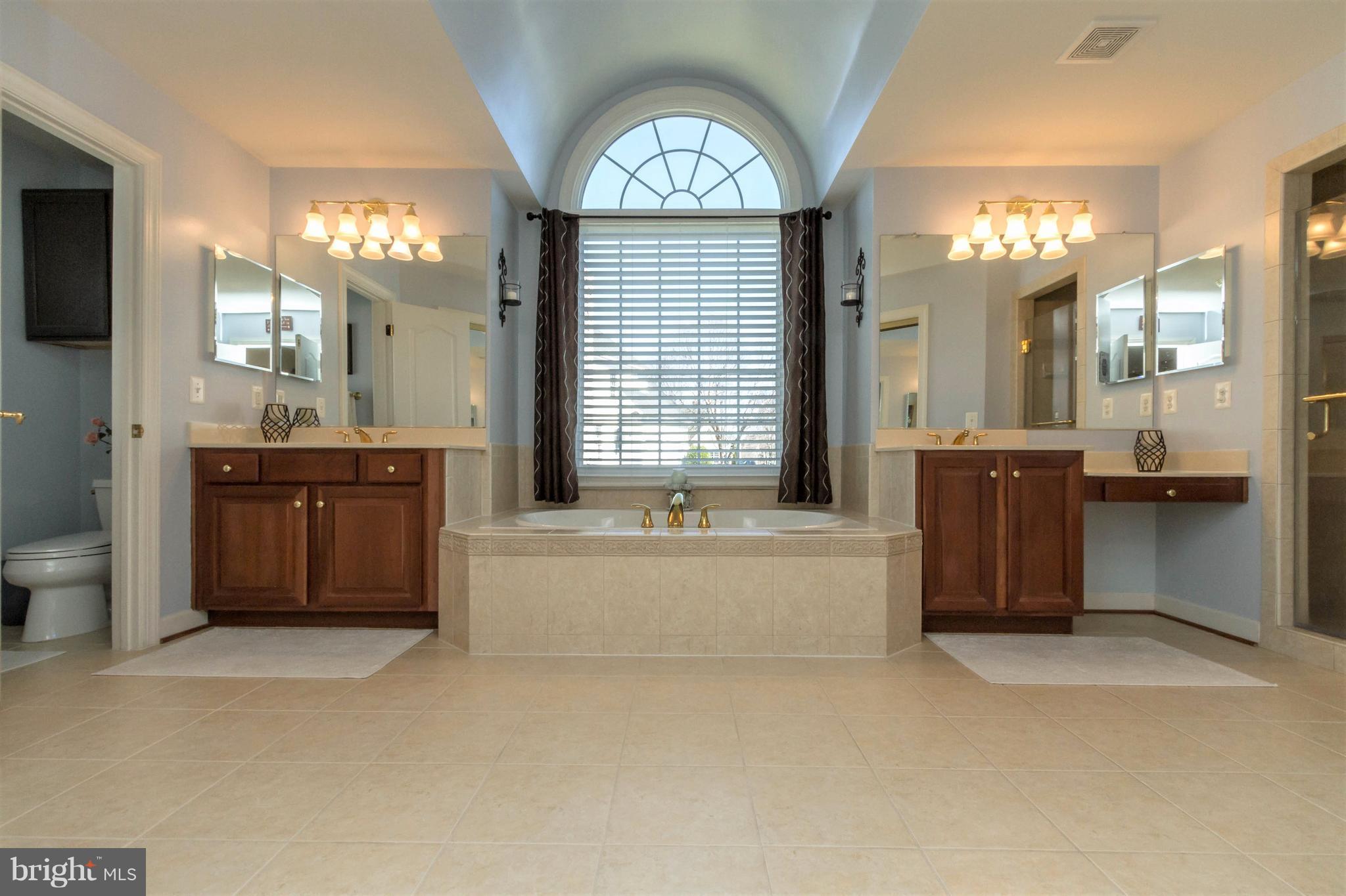 8247 Roxborough Loop Gainesville, VA 20155 - Photo 18 of 30 Master Bath offers Soaking Tub and Large Shower