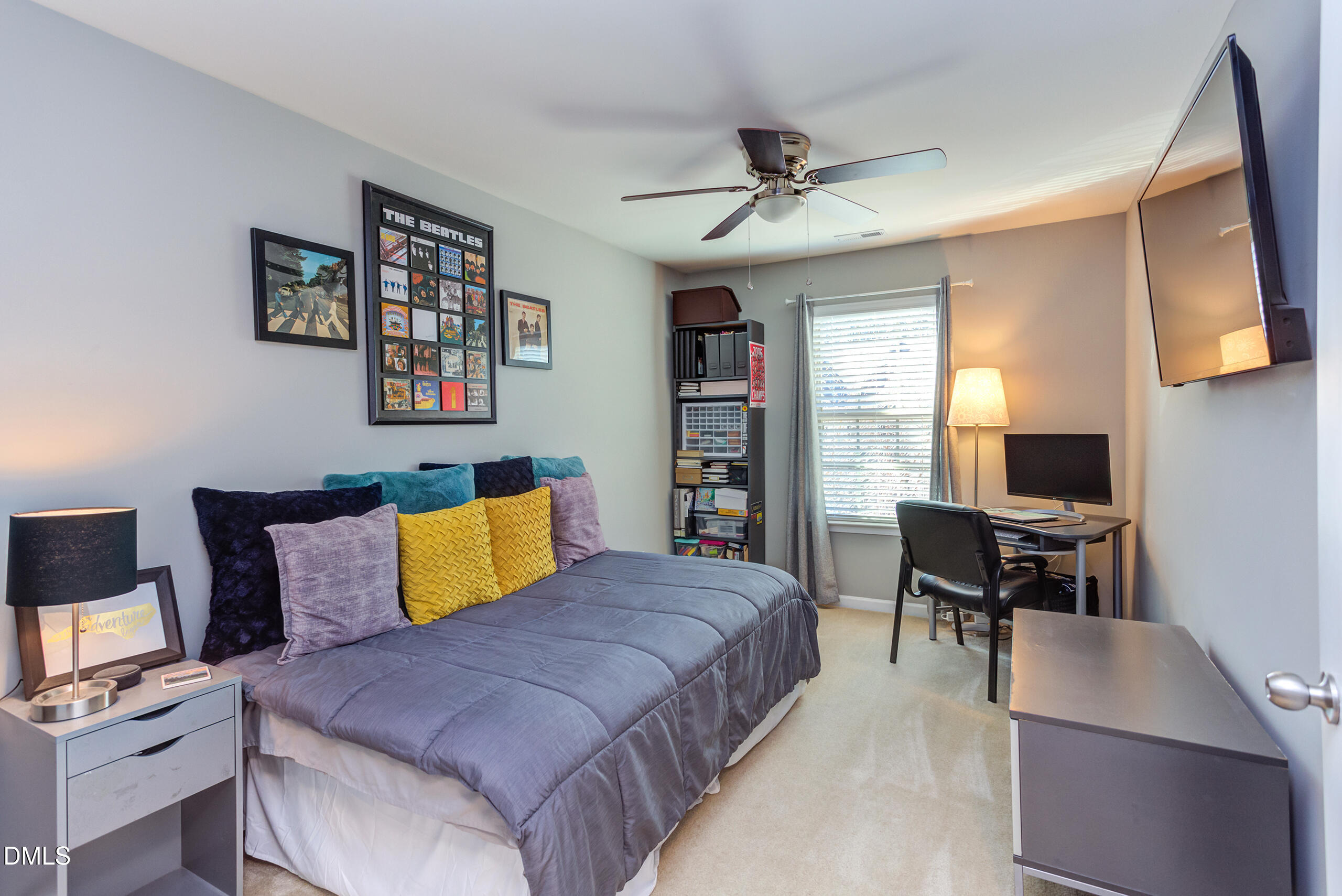 1434 Chatuga Way Wake Forest, NC 27587 - Photo 22 of 29 a bedroom with a bed and furniture