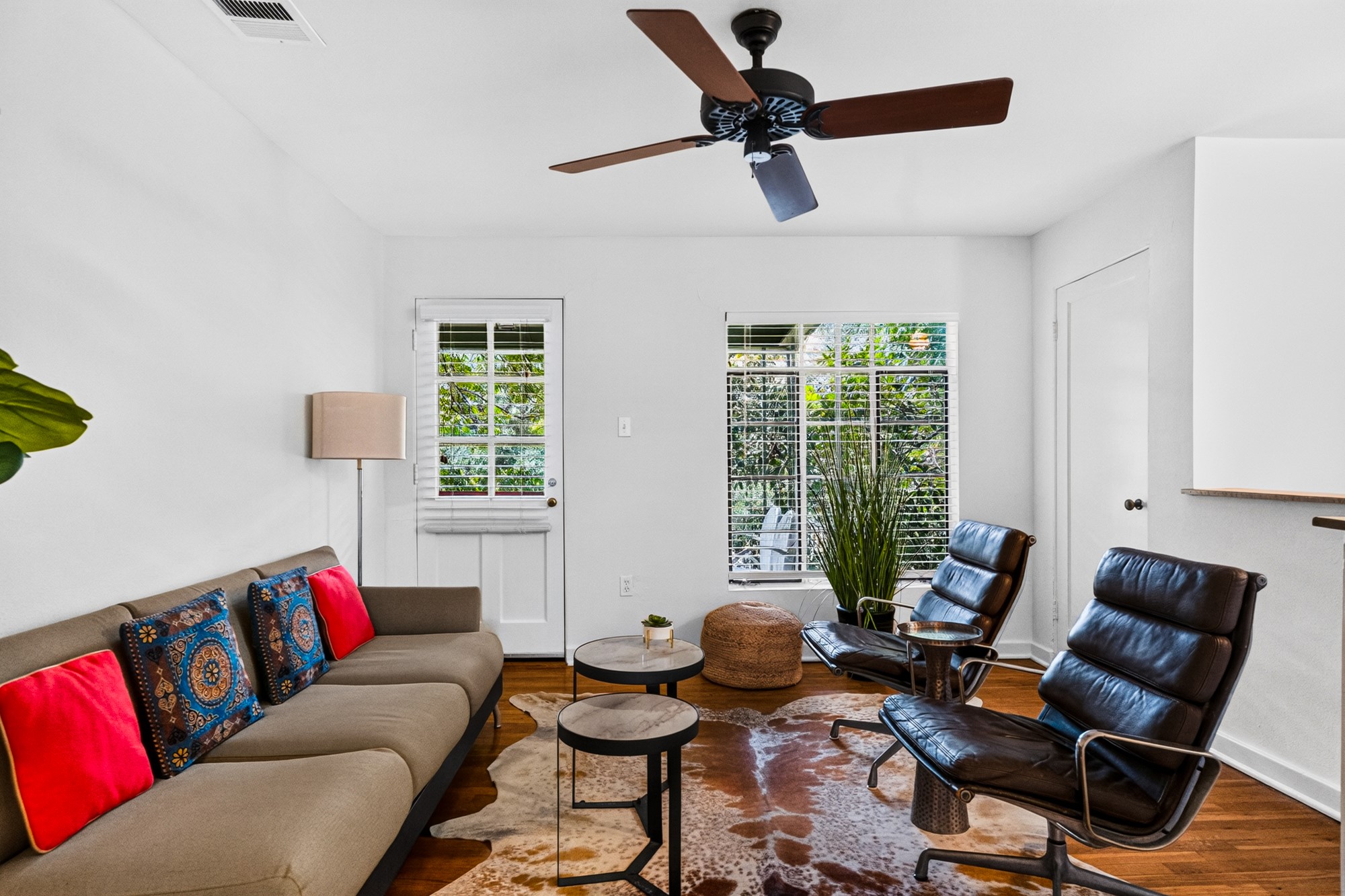1302 Kirkwood Road, Unit B Austin, TX 78722 - Photo 18 of 21 Hardwood floors and bright windows illuminate this comfortable, open living space.