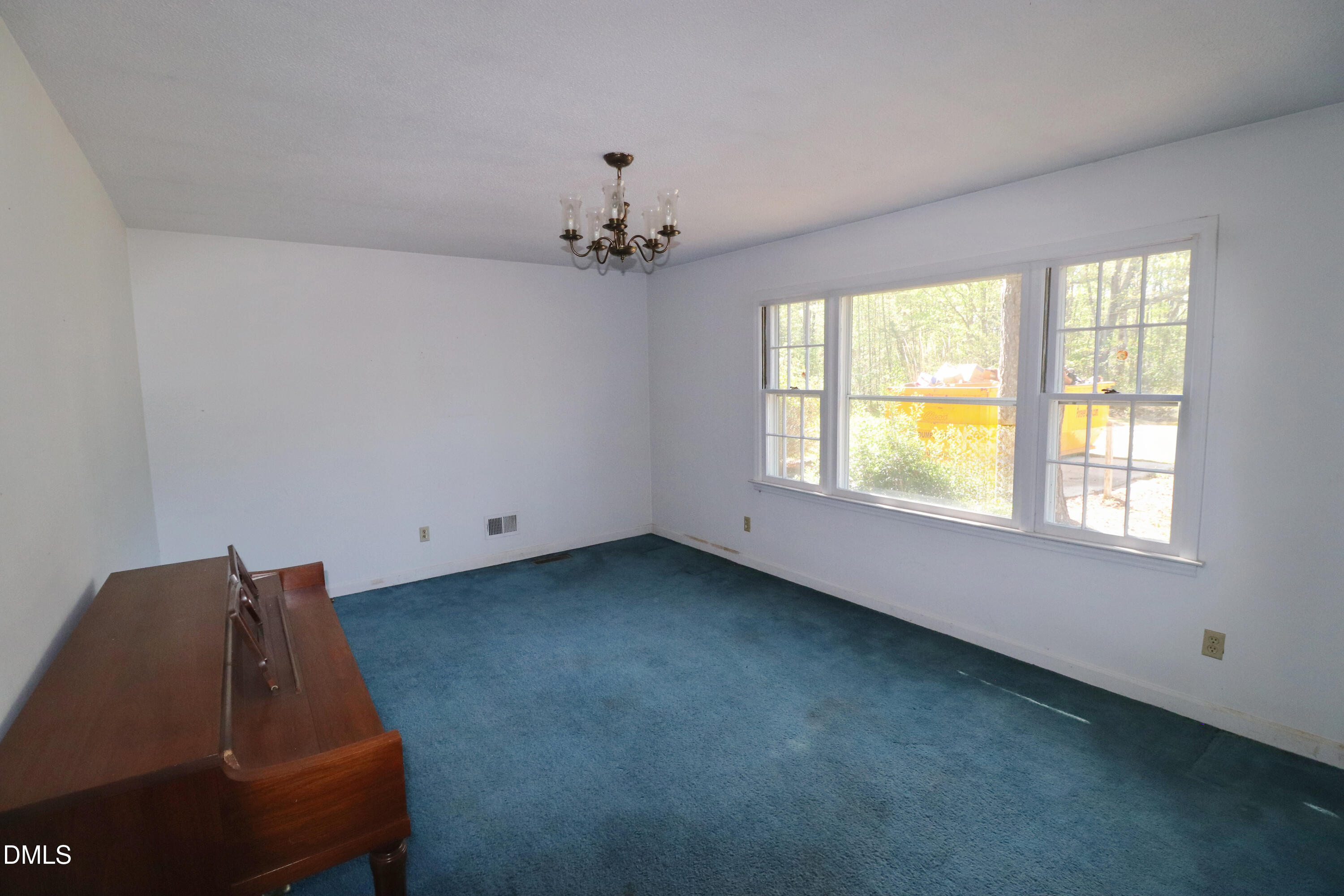 163 Walton Road Youngsville, NC 27596 - Photo 10 of 45 a living room with furniture and a window