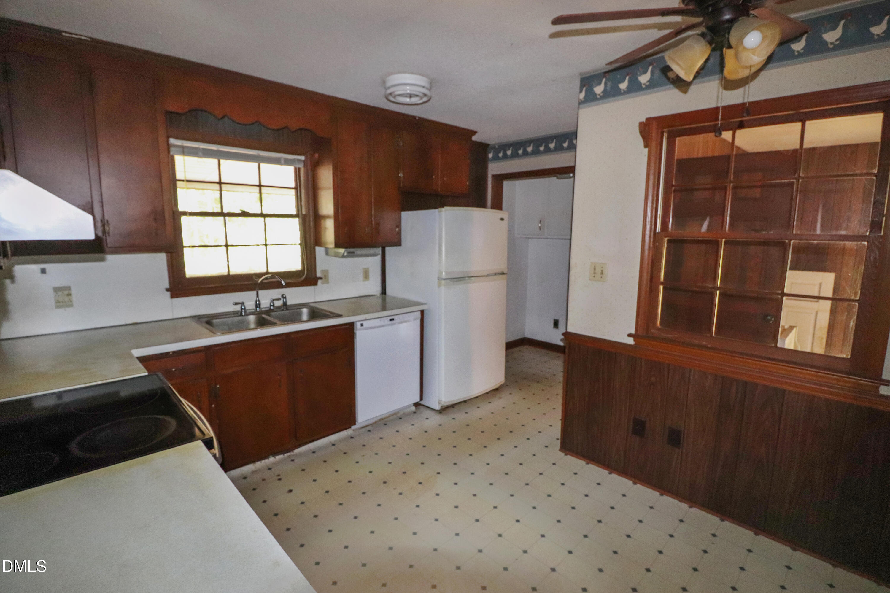 163 Walton Road Youngsville, NC 27596 - Photo 12 of 45 a kitchen with stainless steel appliances a refrigerator a sink a stove a counter space and cabinets
