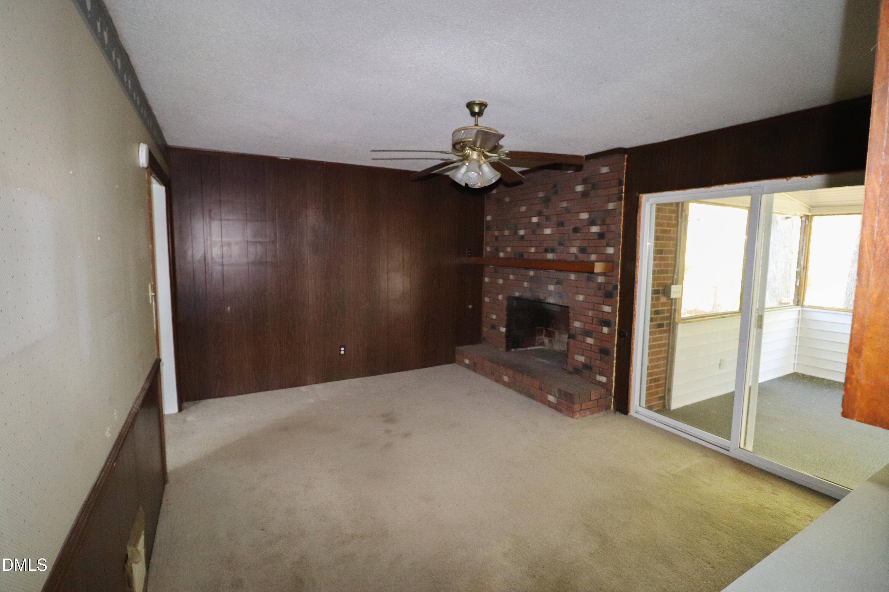 163 Walton Road Youngsville, NC 27596 - Photo 13 of 45 a view of a livingroom with a chandelier fan and windows