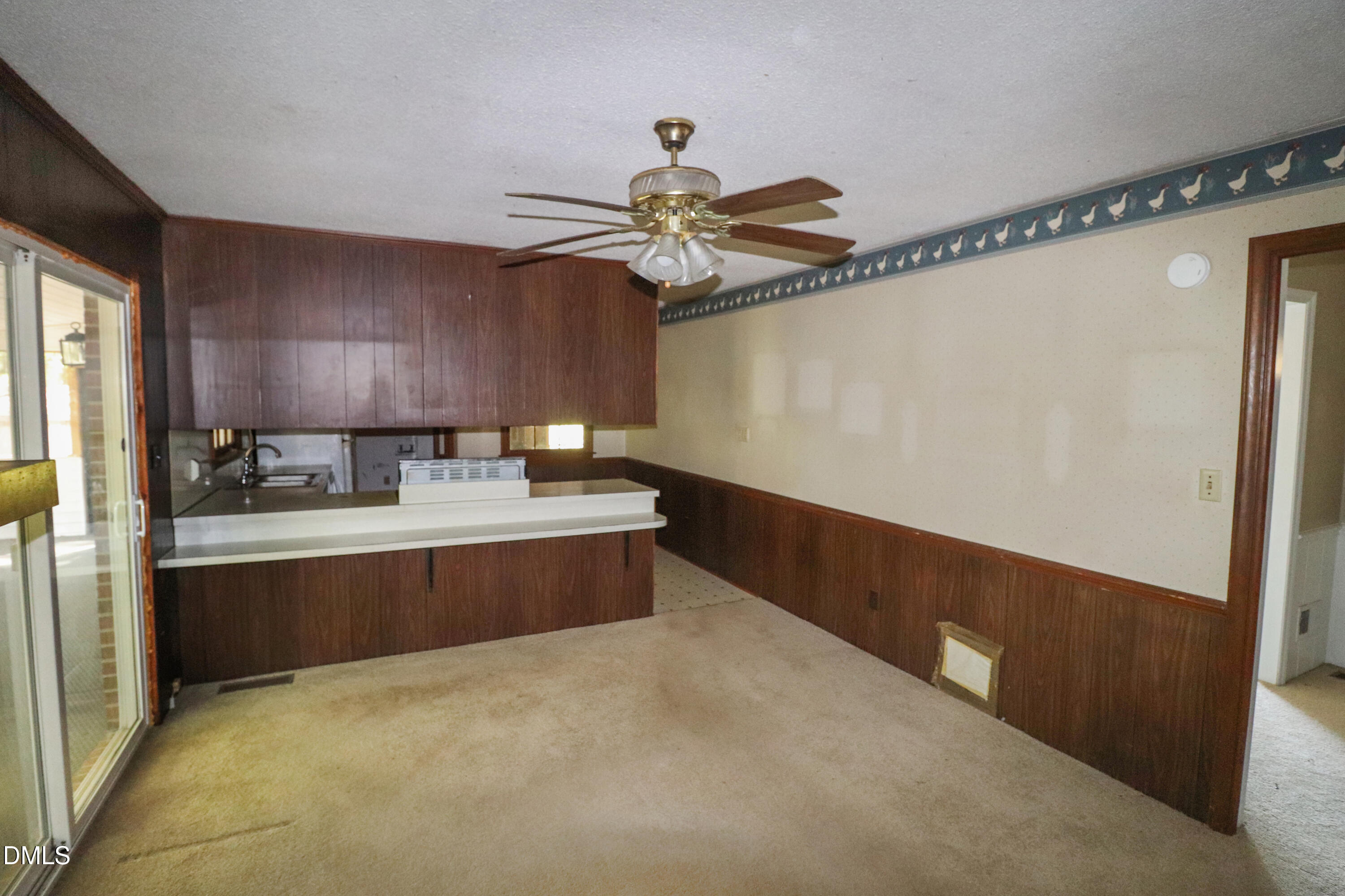 163 Walton Road Youngsville, NC 27596 - Photo 15 of 45 a view of a kitchen with a sink stainless steel appliances and cabinets