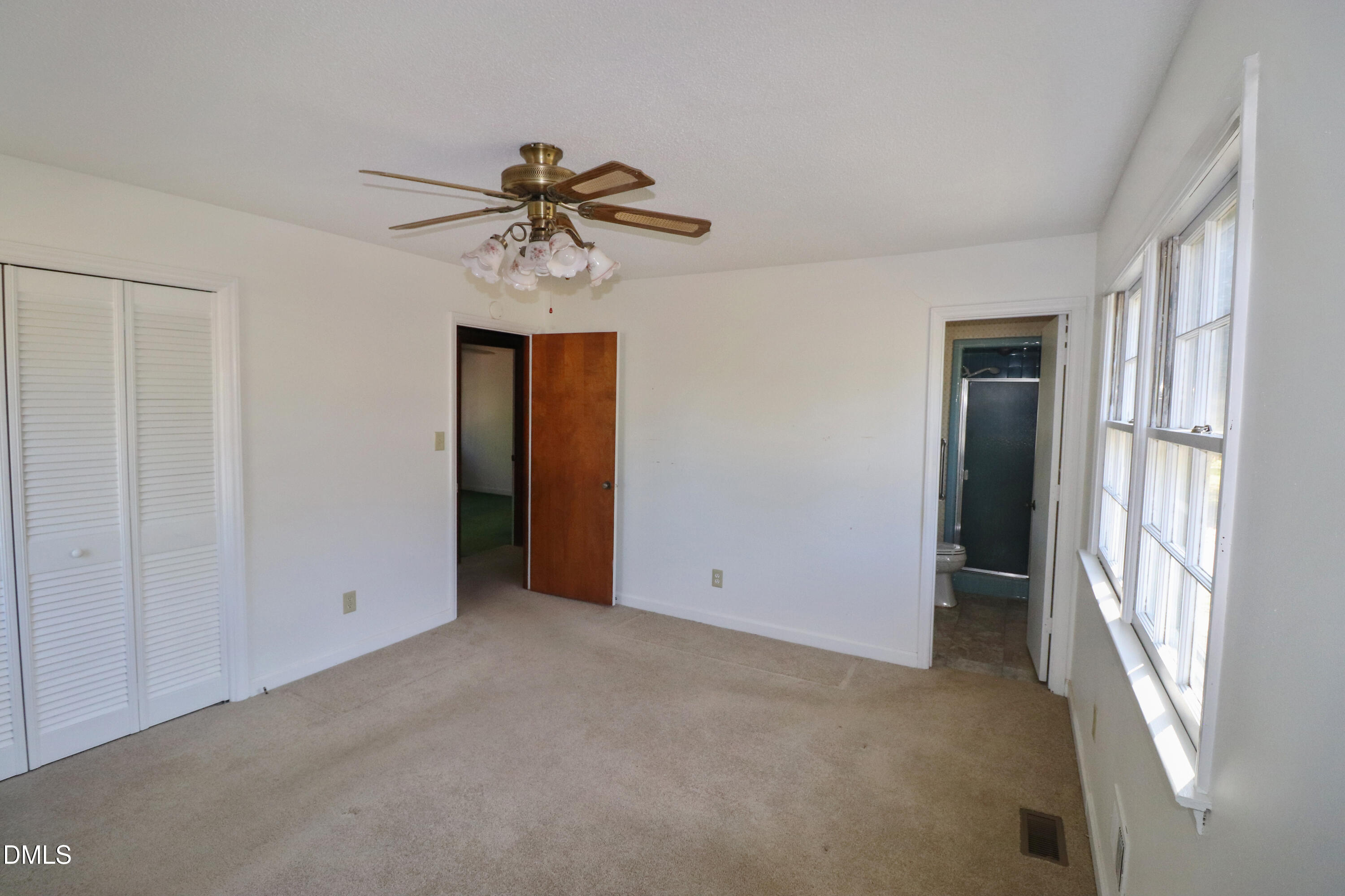 163 Walton Road Youngsville, NC 27596 - Photo 17 of 45 a view of an empty room with a window