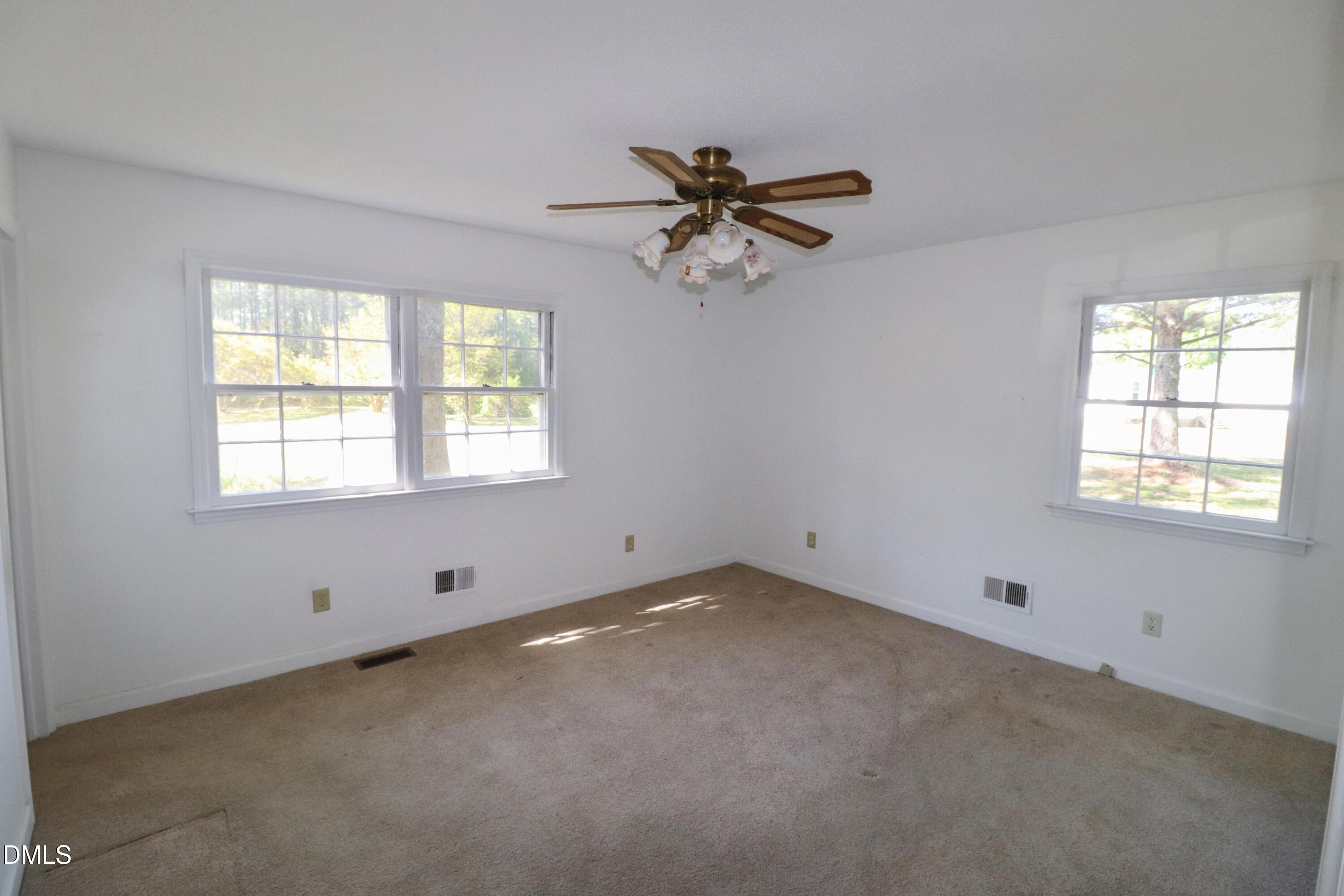 163 Walton Road Youngsville, NC 27596 - Photo 19 of 45 a view of an empty room with a window