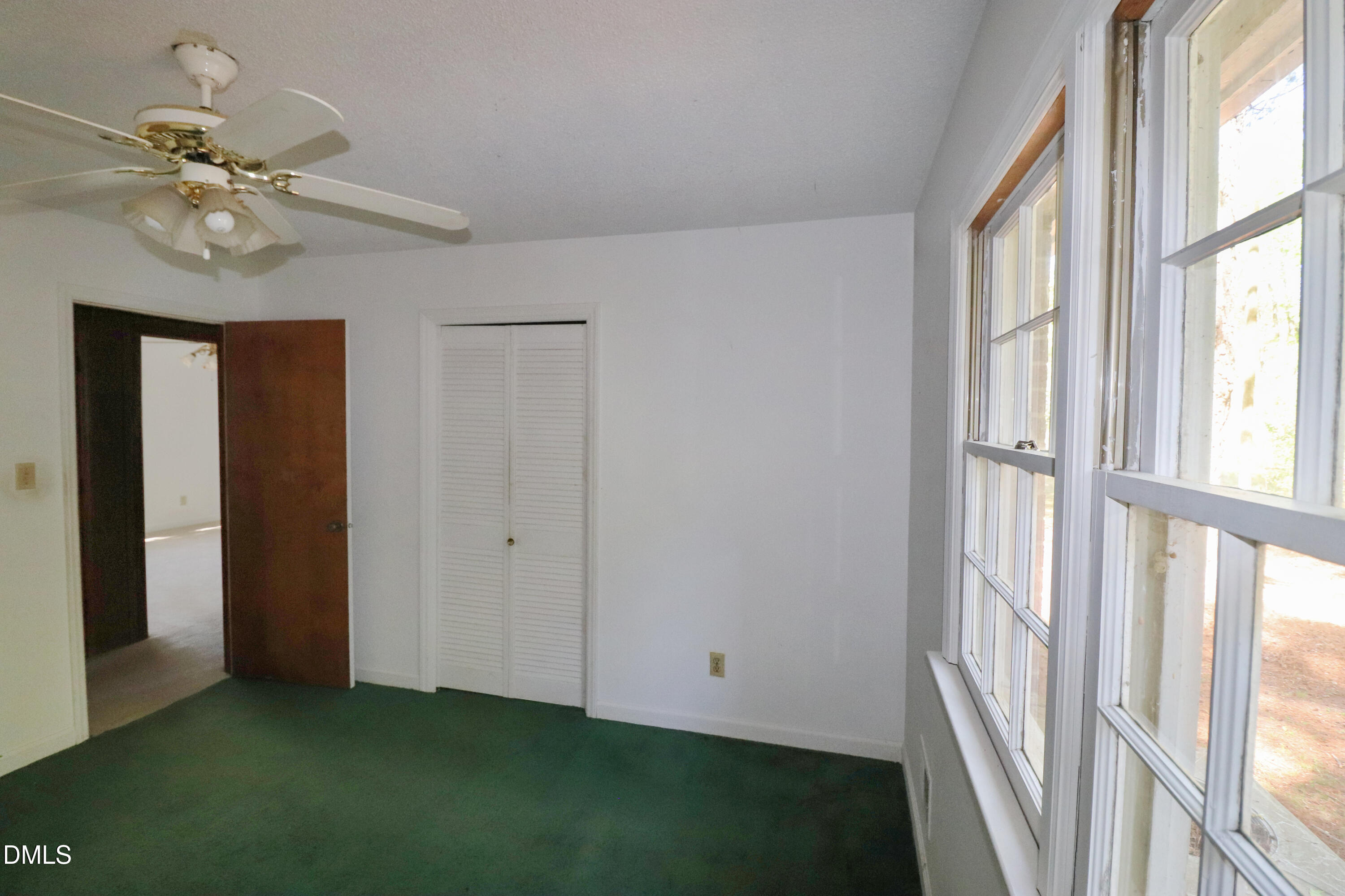 163 Walton Road Youngsville, NC 27596 - Photo 24 of 45 a view of an empty room with chandelier fan and fire place