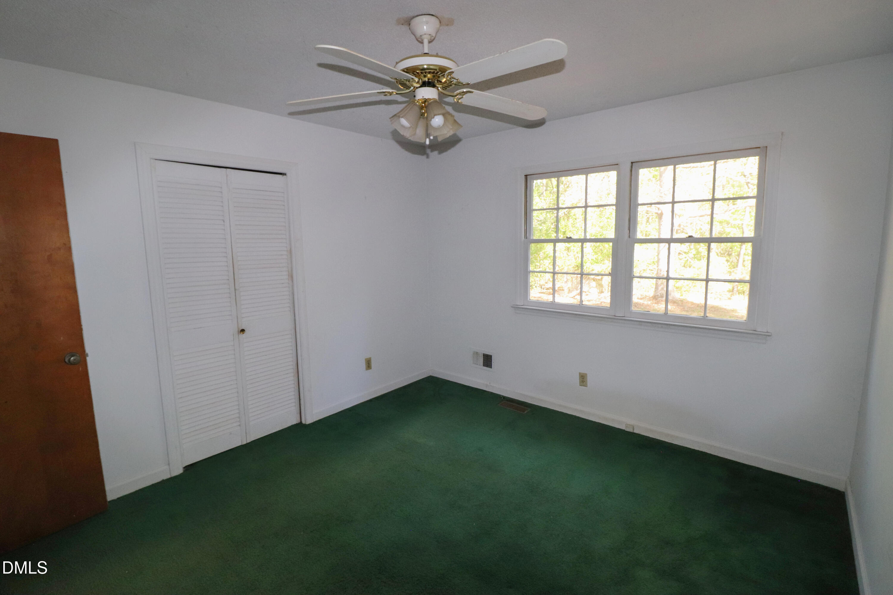 163 Walton Road Youngsville, NC 27596 - Photo 25 of 45 a view of an empty room with a window