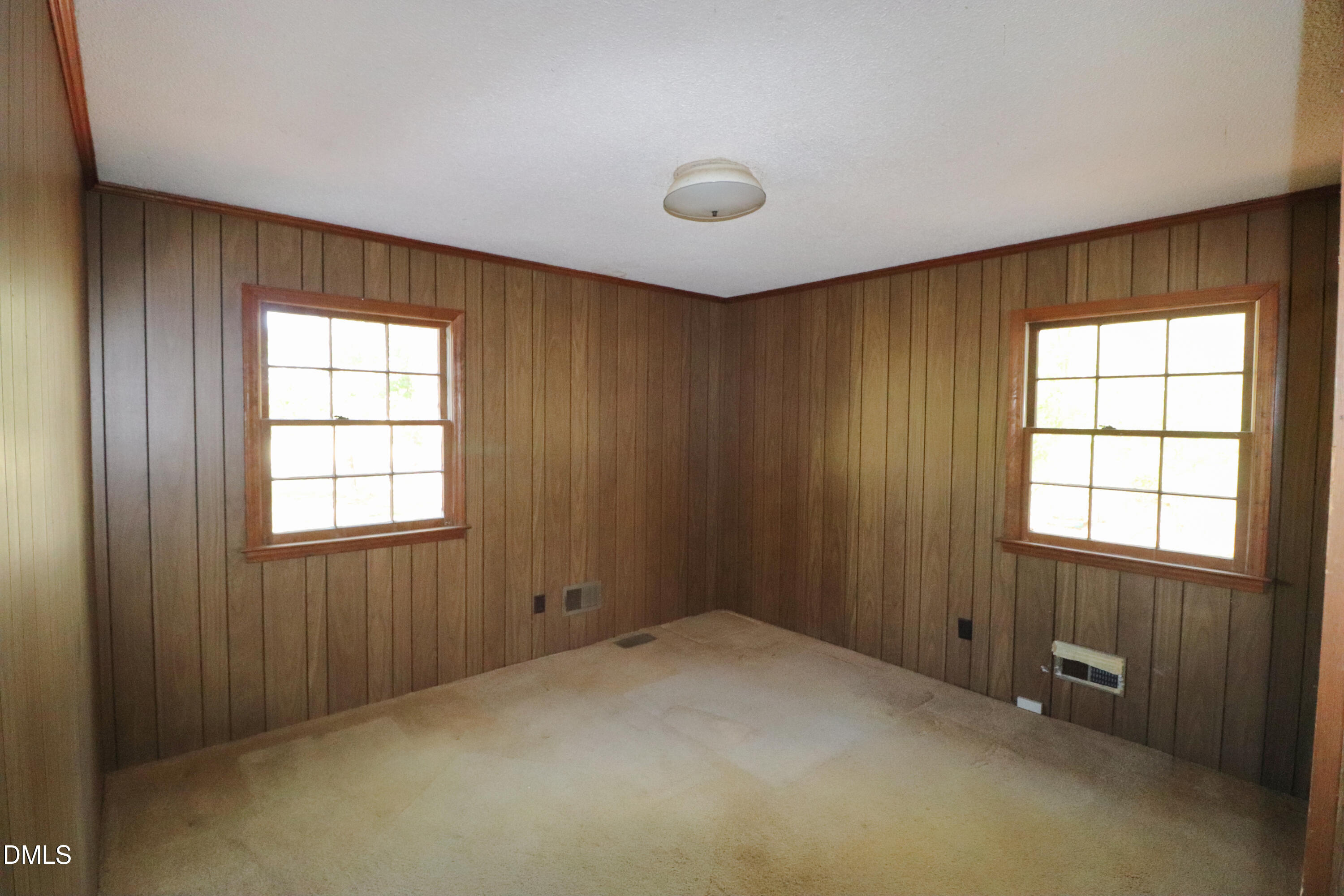 163 Walton Road Youngsville, NC 27596 - Photo 29 of 45 an empty room with windows