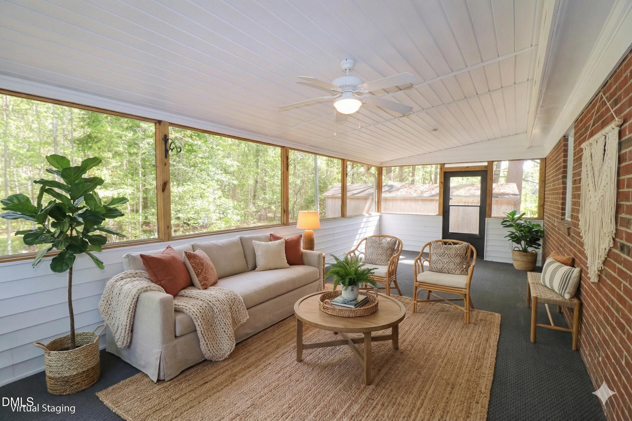 163 Walton Road Youngsville, NC 27596 - Photo 2 of 45 a living room with furniture and a large window