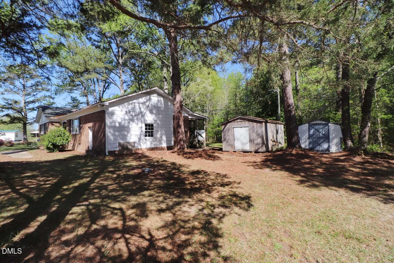 163 Walton Road Youngsville, NC 27596 - Photo 39 of 45 a view of a house with backyard and trees