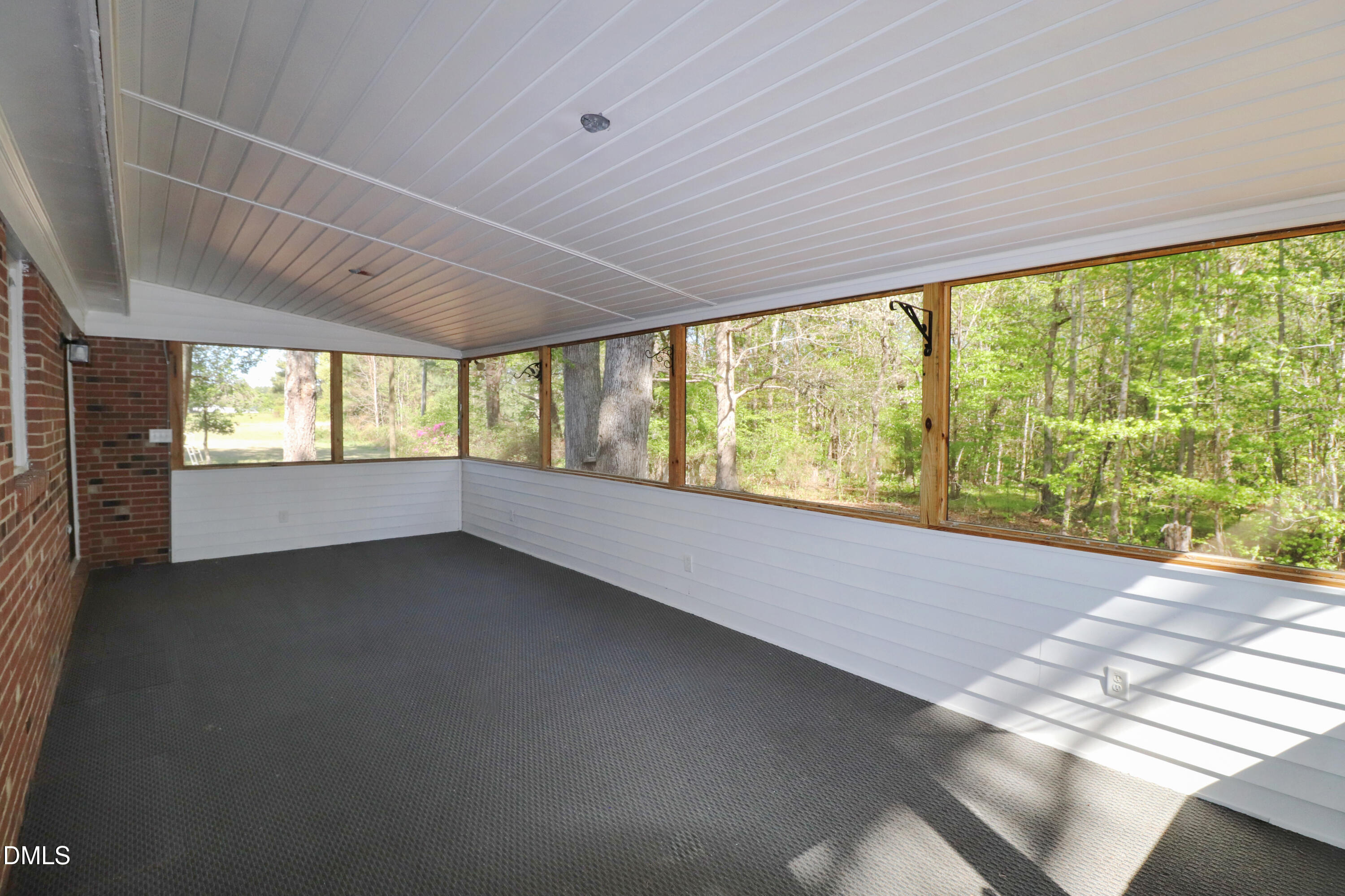 163 Walton Road Youngsville, NC 27596 - Photo 4 of 45 a view of an empty room with a window