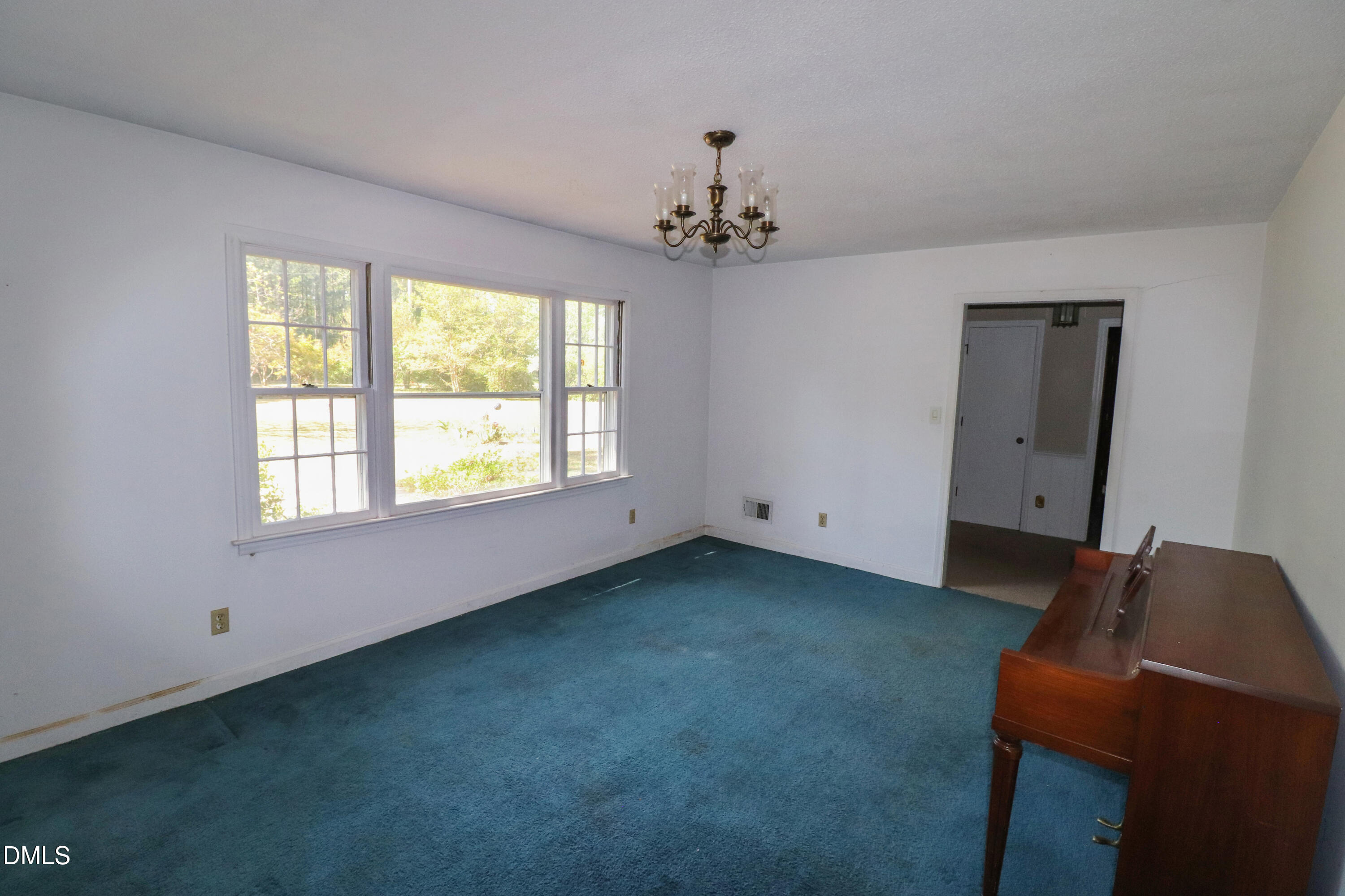 163 Walton Road Youngsville, NC 27596 - Photo 8 of 45 a view of a livingroom with a ceiling fan and window
