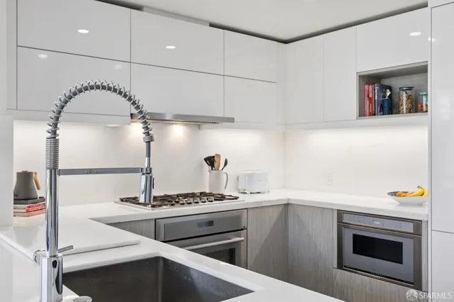 a kitchen with a stove and a sink