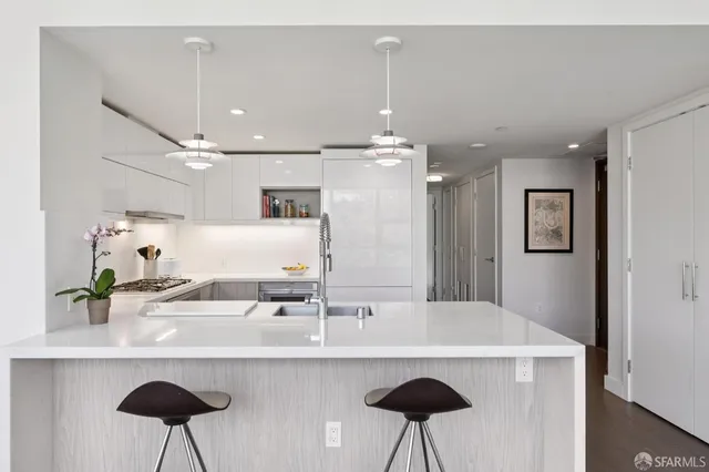 a bathroom with a sink and a large mirror