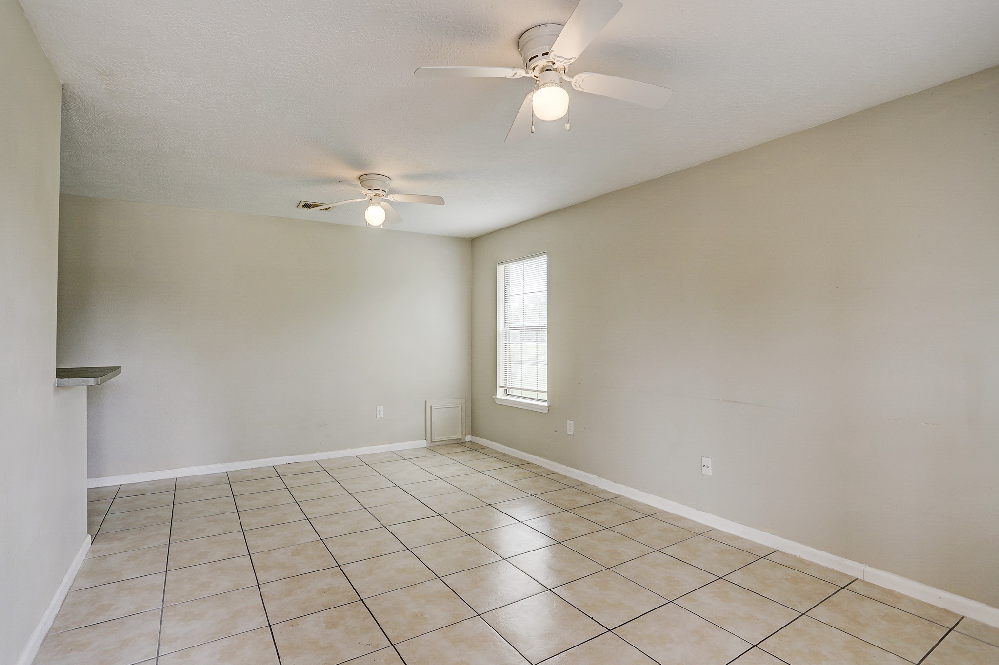 330 6th Street Hempstead, TX 77445 - Photo 2 of 13 a view of an empty room with a window