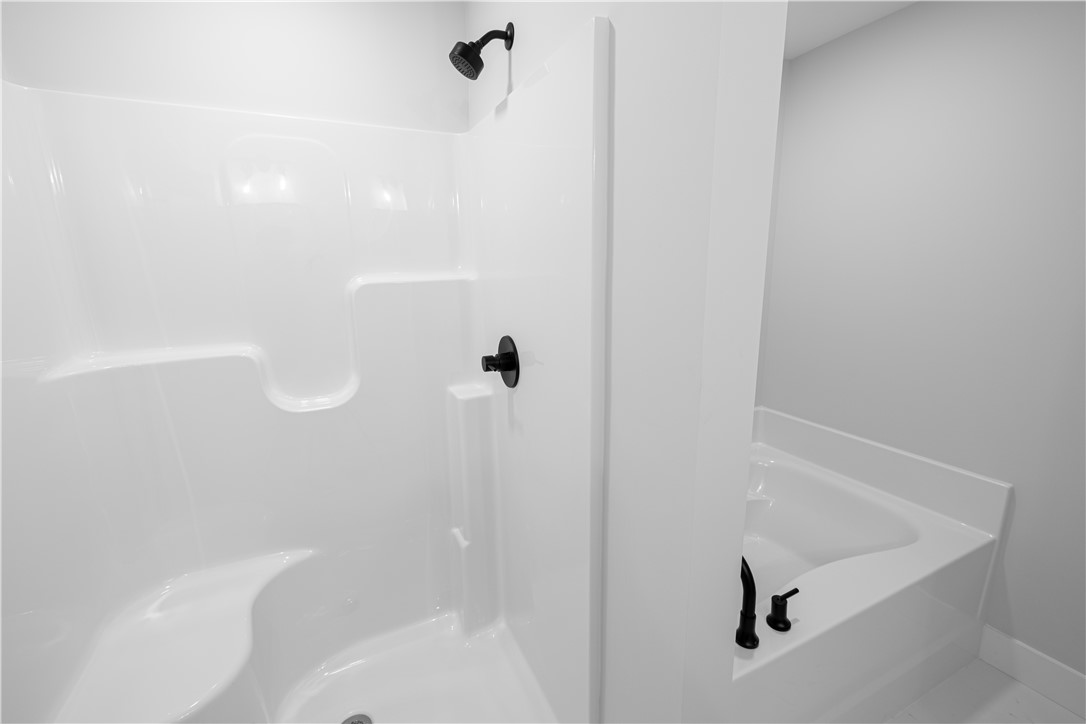 105 Leon Drive Anderson, SC 29621 - Photo 13 of 46 This clean and inviting bathroom features a built-in shower and a soaking tub for ultimate relaxation.