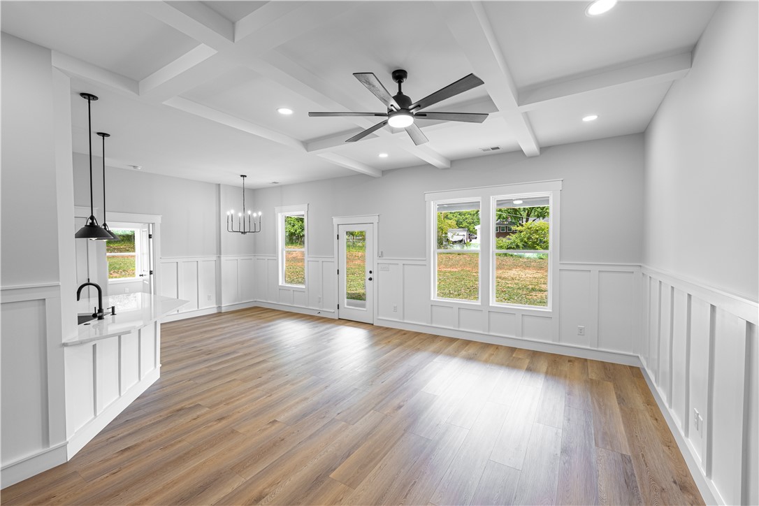 105 Leon Drive Anderson, SC 29621 - Photo 15 of 46 This bright, airy interior features coffered ceilings, wainscoting, and durable laminate flooring.