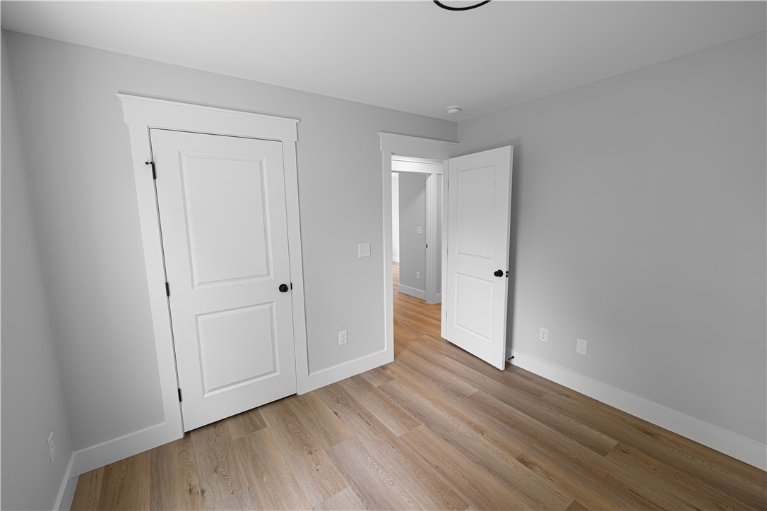 105 Leon Drive Anderson, SC 29621 - Photo 22 of 46 This spacious room features newly installed hardwood floors, offering a clean and versatile living space.