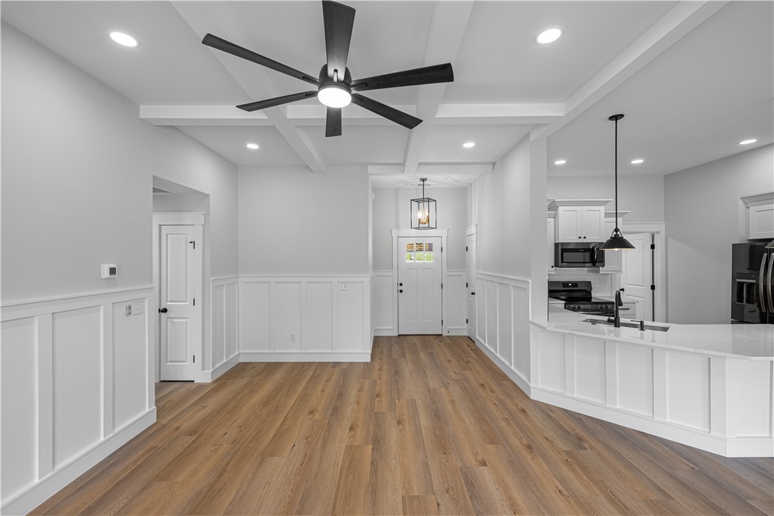 105 Leon Drive Anderson, SC 29621 - Photo 23 of 46 This bright, open-concept interior features modern flooring, recessed lighting, and a well-appointed kitchen.