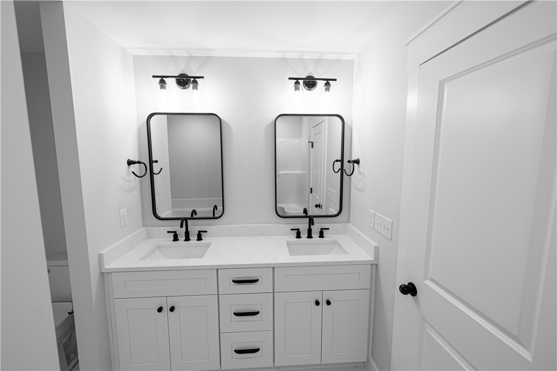 105 Leon Drive Anderson, SC 29621 - Photo 26 of 46 This primary bathroom features a dual vanity with ample storage and modern fixtures.
