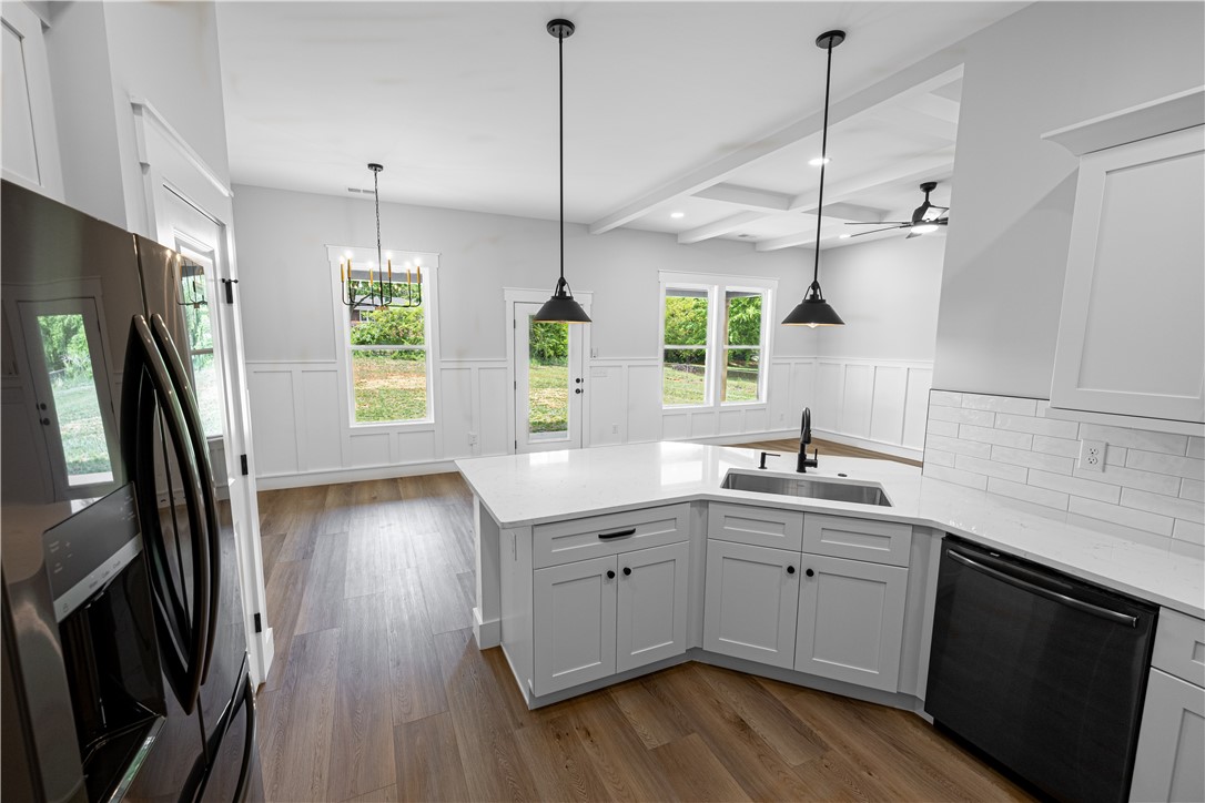 105 Leon Drive Anderson, SC 29621 - Photo 29 of 46 This modern kitchen features a spacious island and bright natural light.