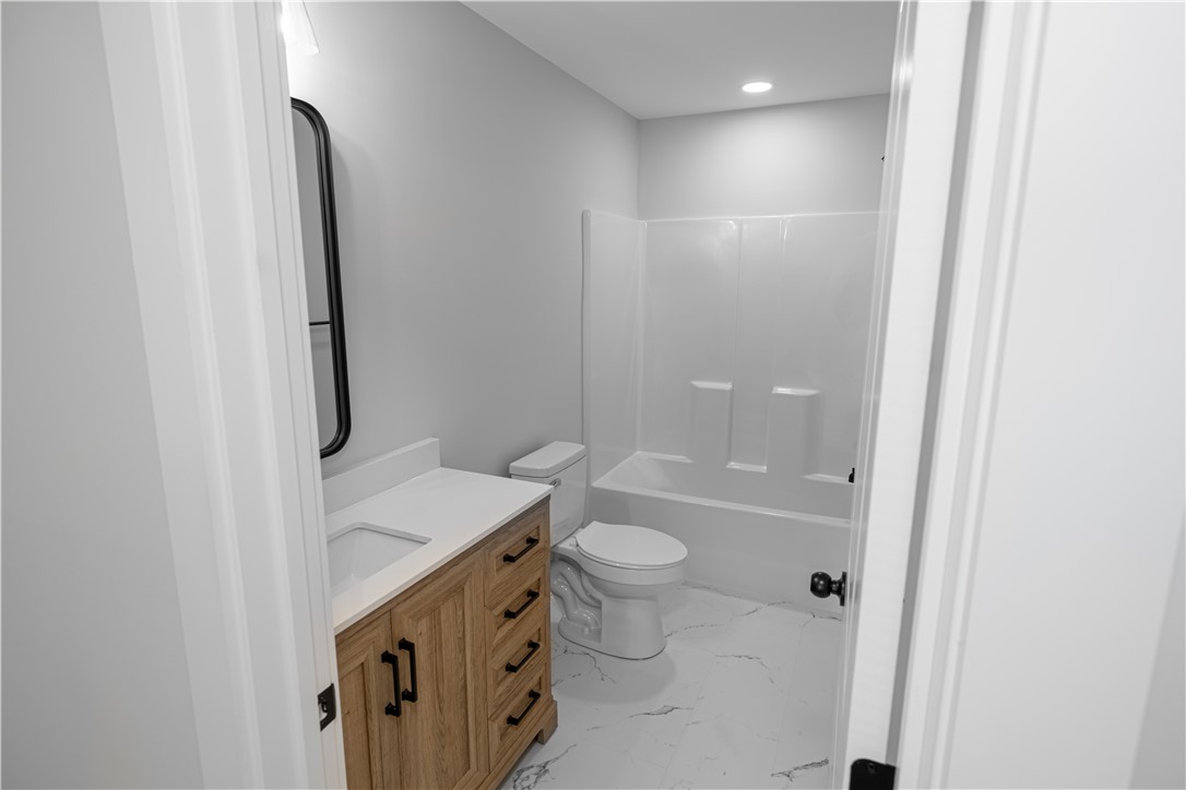 105 Leon Drive Anderson, SC 29621 - Photo 40 of 46 This sleek bathroom features a modern vanity and clean lines, offering a fresh, bright retreat.