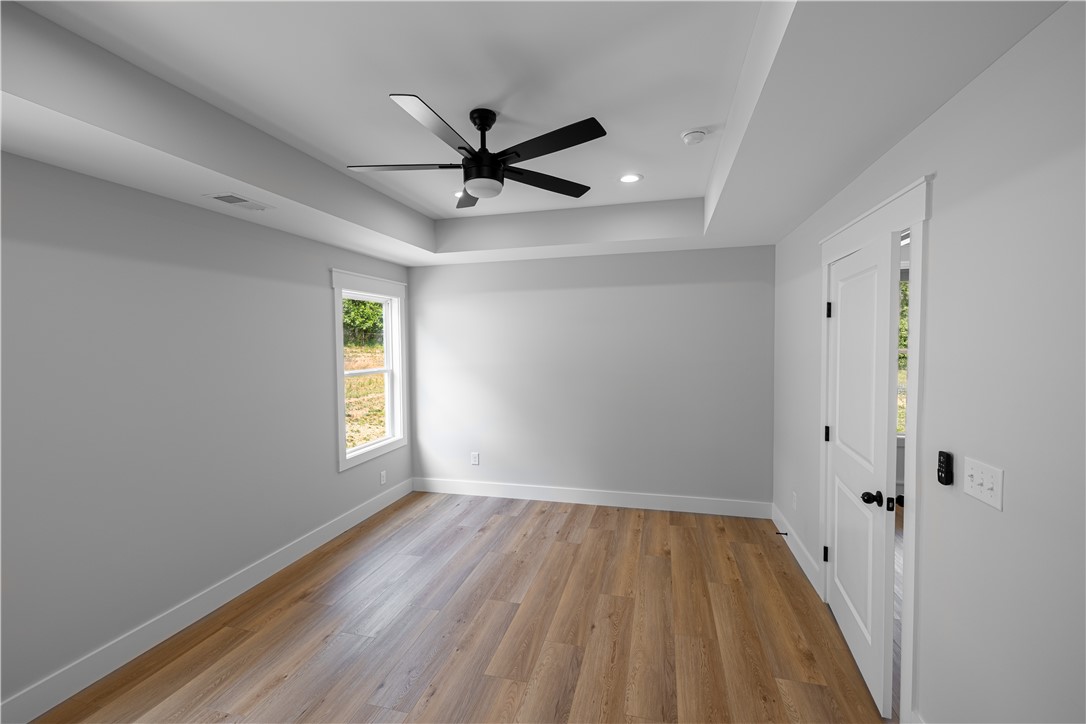 105 Leon Drive Anderson, SC 29621 - Photo 42 of 46 An inviting room features a contemporary ceiling fan, recessed lighting, and hardwood flooring.