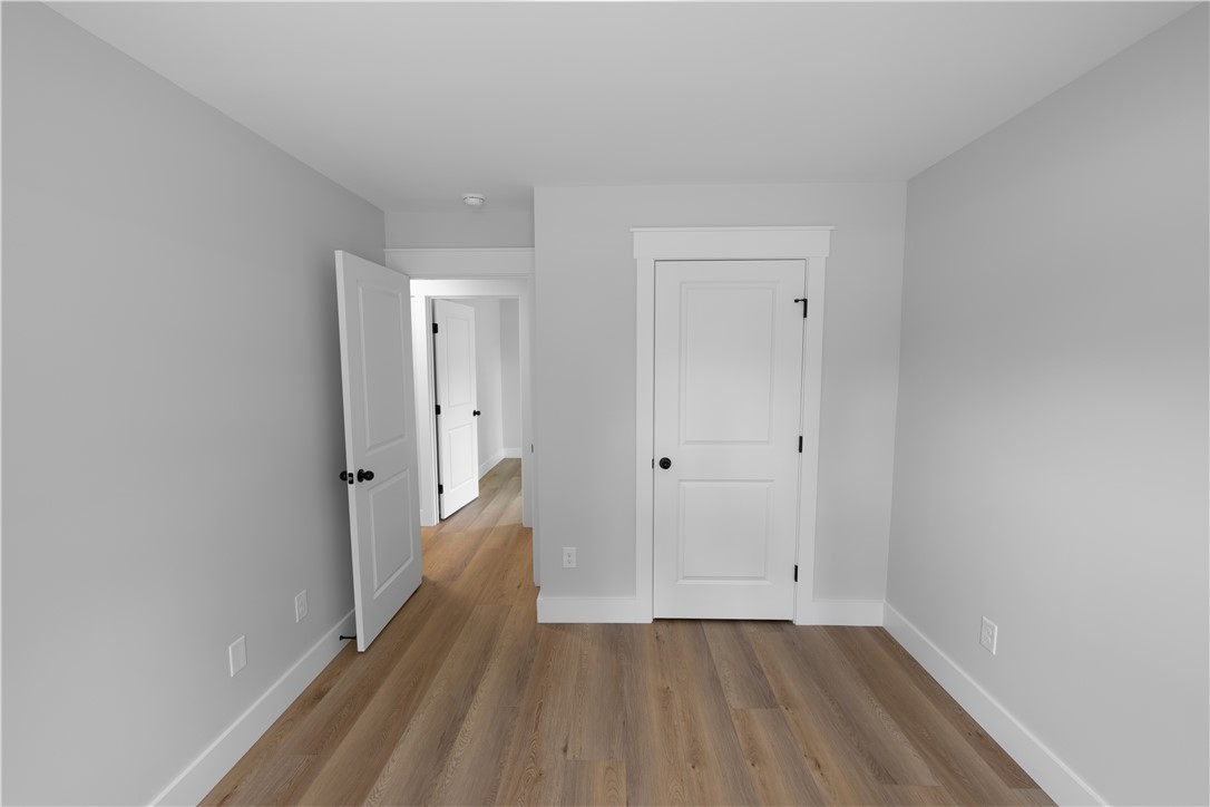 105 Leon Drive Anderson, SC 29621 - Photo 45 of 46 This clean, bright space features elegant wood flooring and modern doors, offering a versatile blank canvas.